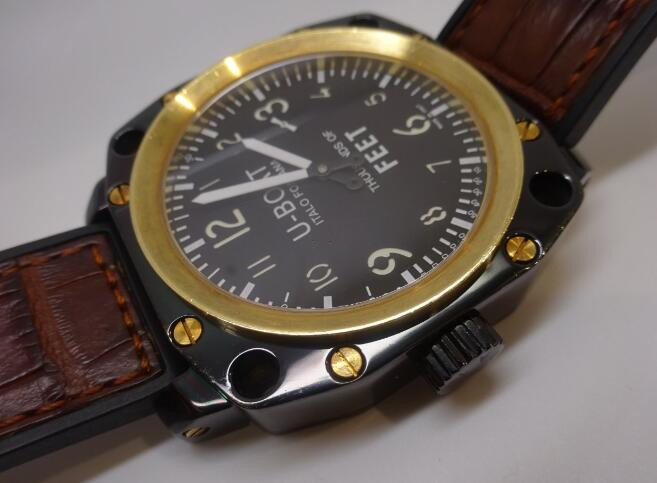 Swiss-made knock-off watches forever are charming with black steel and gold materials.